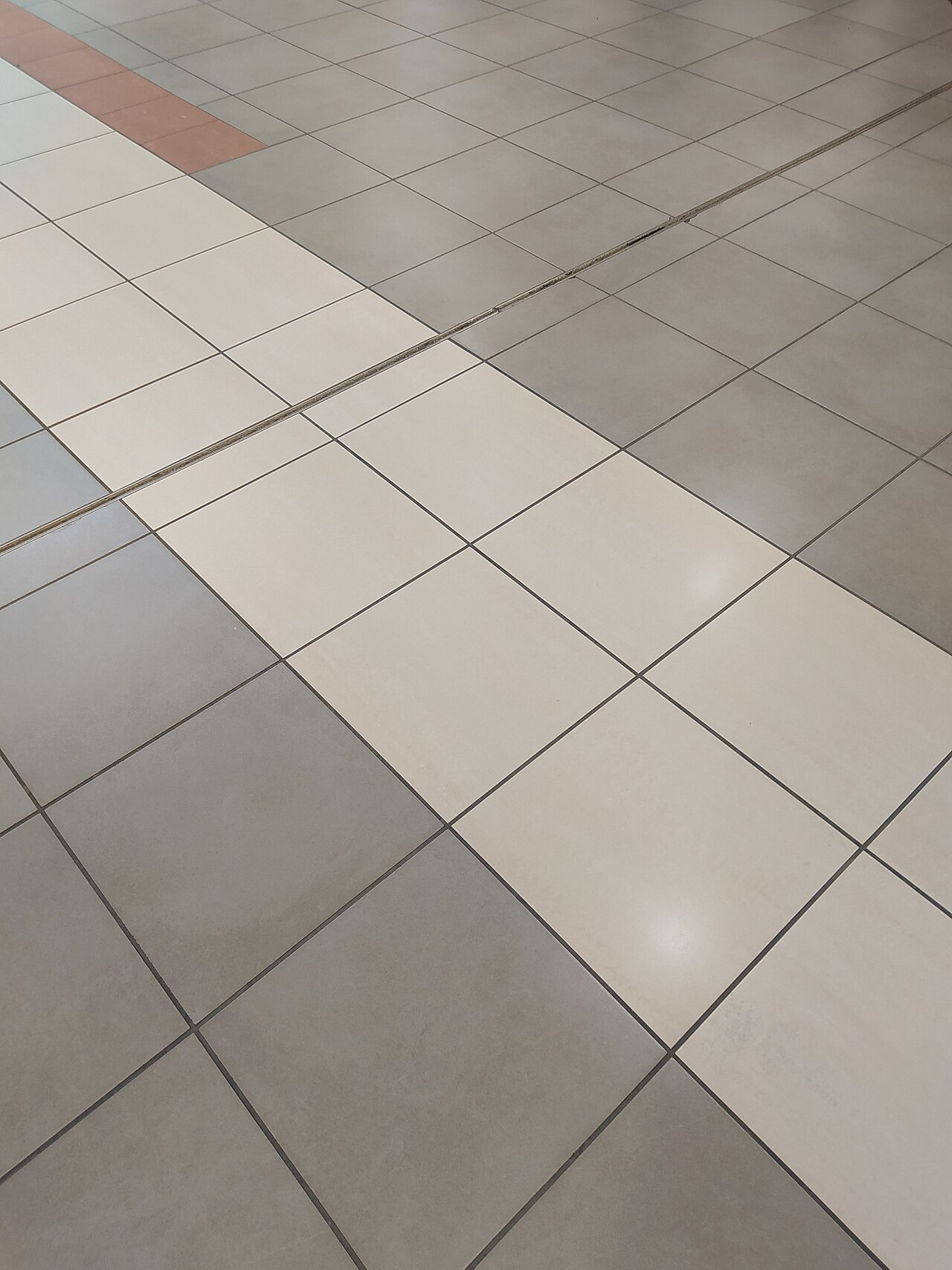 Grey and cream square porcelain floor tiles